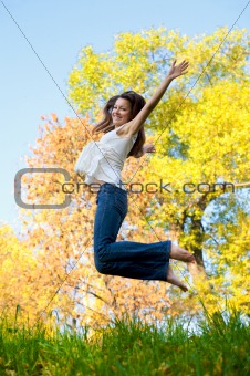 Happy beautiful girl jumping