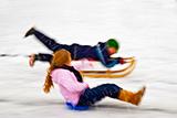children sledging in falling snow
children sledging 
