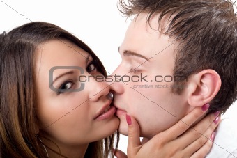 Portrait of the kissing young beauty couple 