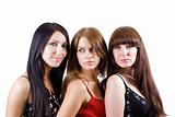 Portrait of three beautiful young women. Isolated