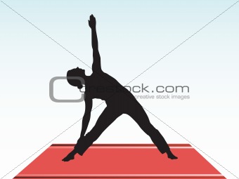 female silhouette doing yoga on the floor