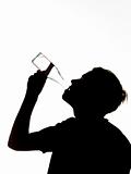 Silhouette of a man drinking