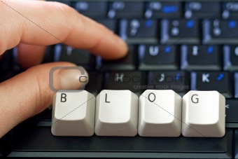 Hand and laptop keyboard