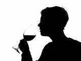 Silhouette of a man with a glass of wine