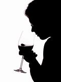 Silhouette of a man with a glass of wine