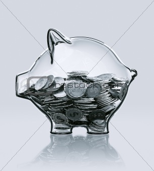 Piggy bank in glass filled with coins