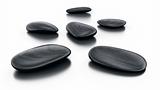 Black stones on reflective floor