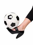 Fotball and a lady`s slipper