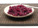 Cooked red cabbage arranged on a plate with fork