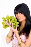 brunette with green grapes