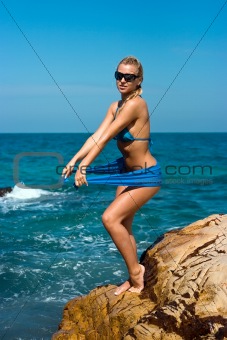 Lady on rocky beach