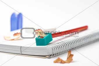 red pencils,sharpener and chips