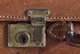 Detail of an old leather suitcase