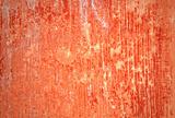 Grungy red wall with lots of streaks