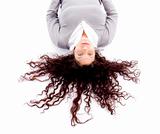woman laying down on floor with hair spread out