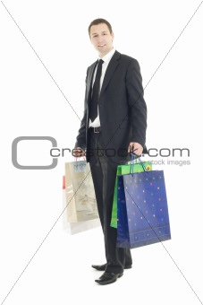 Elegant man holding bags