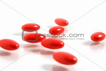 A few medicine tablets on a table
