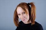 Portrait of a young beautiful woman with pigtail
