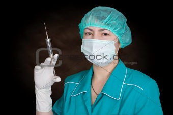 Nurse with syringe in hand