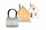 Lock and Houses Isolated on a White Background.