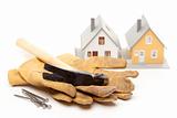 Hammer, Gloves, Nails and House Isolated on a White Background.