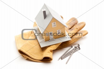 House, Gloves and Nails Isolated on a White Background.