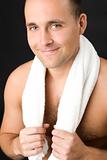 Smiling man with white towel