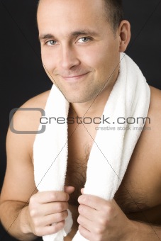Smiling man with white towel