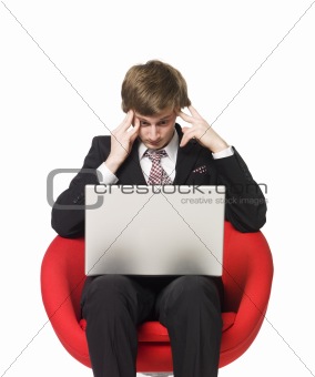 Depressed man with a laptop