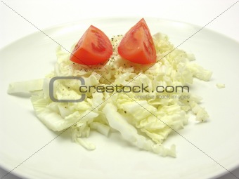Close-up view on chinese cabbage and tomatoes with pepper