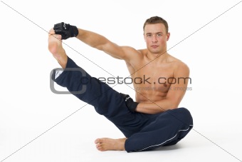 Handsome man stretch his body