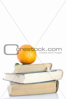 orange on books isolated on white
