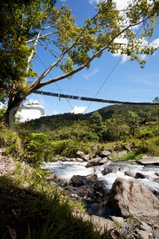 Mountain River with Hanging Bridge