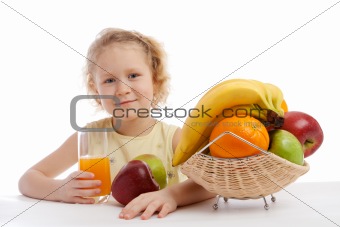 Little girl with juice and fruit