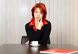 pensive caucasian businesswoman in the office