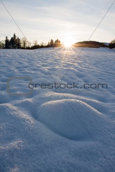 Sunrise or sunset against a winter background