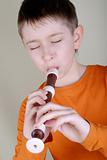 The boy playing the flute