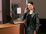 Attractive business woman having a call