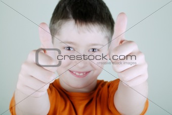 The boy with thumb-up