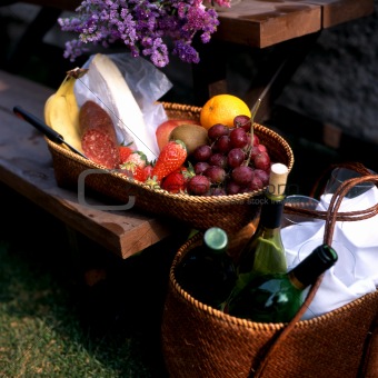 Fruits and wine on picnic table