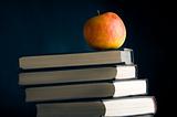 A red apple on a books