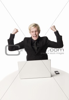 Happy man in front of computer