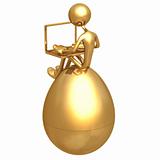 Sitting On Gold Nest Egg With Laptop