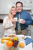 Happy Attractive Woman and Businessman In Kitchen.