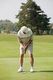 Elderly Man Playing Golf