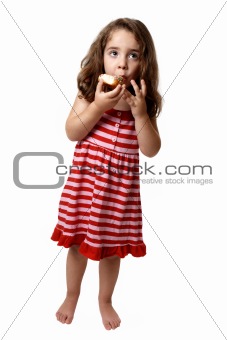 Little girl eating doughnut