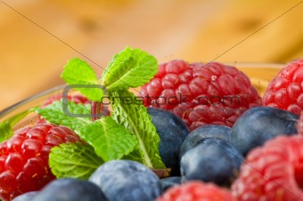 Blueberry, ruspberry and mint leaves