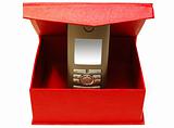 Gray (silver) mobile (radio) telephone and red cardboard box.