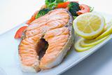 fresh salmon cooked with tomato salad