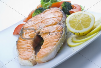 fresh salmon cooked with tomato salad
